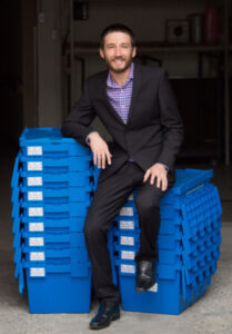 Jesse Meyer sitting on clue boxes