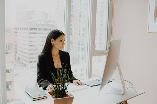 A professional woman planning her upcoming Corporate Office Move