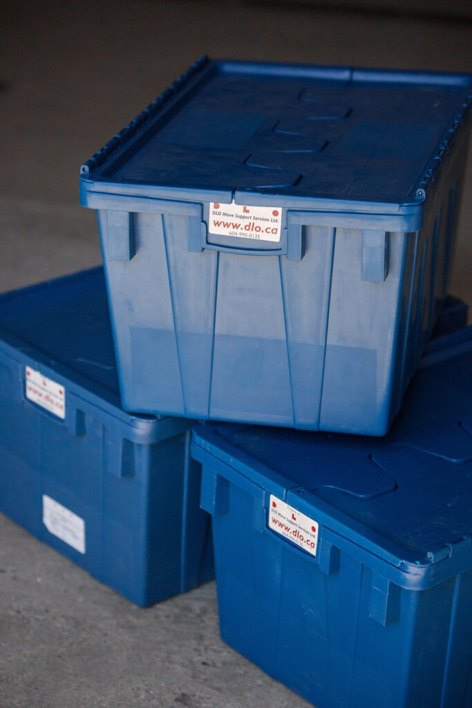 Moving boxes with the DLO logo on them